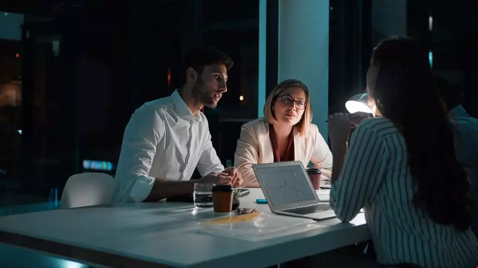 Partner, people and laptop in office at night with documents for deadline or overtime as accountant. Employee, teamwork and information for financial reviews, records and auditing in business report; Shutterstock ID 2475090839; purchase_order: 20703058; job: Akestam Holst; client: Sverige; other: Akavia